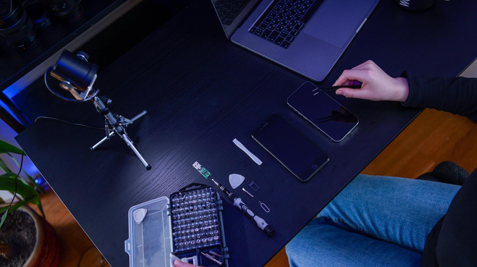 Technician performing expert smartphone repair
